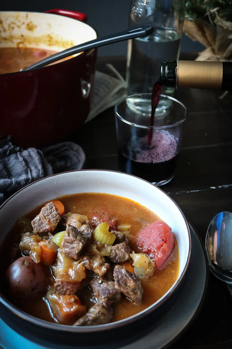 Bowl of stew with red wine
