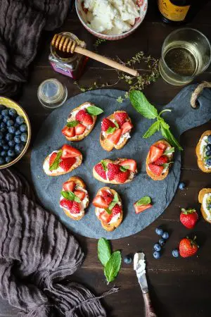 Topped with balsamic infused strawberries and ricotta cheese, this delightful appetizer or dessert is one of my favorite crostini recipes yet!