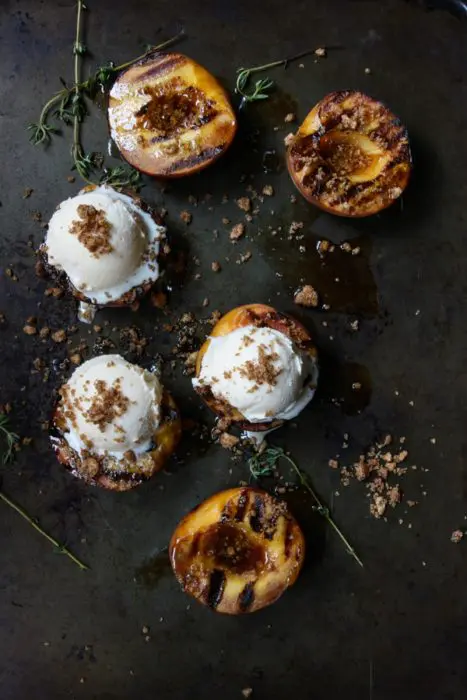 Halved peaches grilled with a buttery cinnamon honey drizzle.