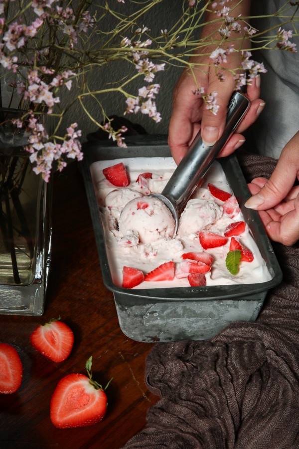 Scooping out strawberry ice cream
