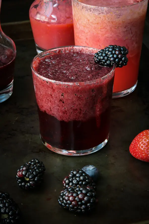 Blackberry Blueberry mimosa drink on tray