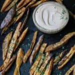 Sweet Potato Fries on serving tray with sauce