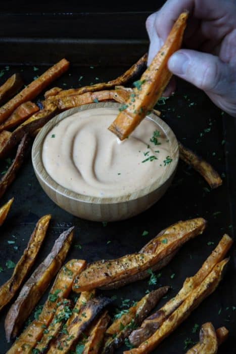 Sweet potato fries dipped in a chipotle sauce